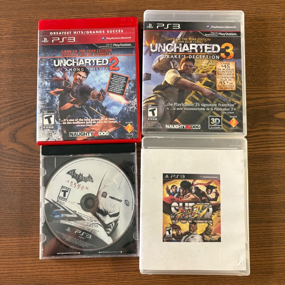 Sony PS3 Video Game Lot of 4 Uncharted 2 3 Batman Arkham City Street Fighter‎ IV